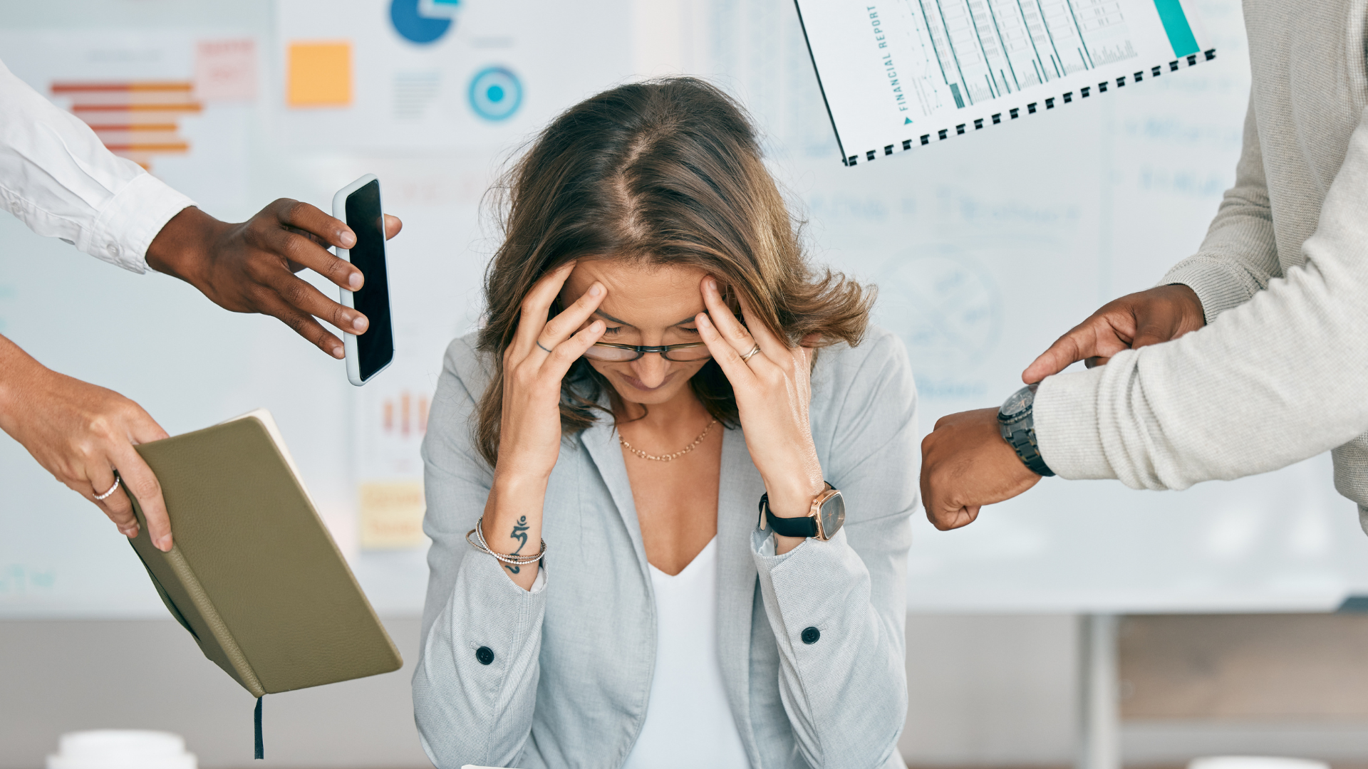 Stressed HR professional surrounded by workplace demands, symbolizing mental health stigma in the workplace.