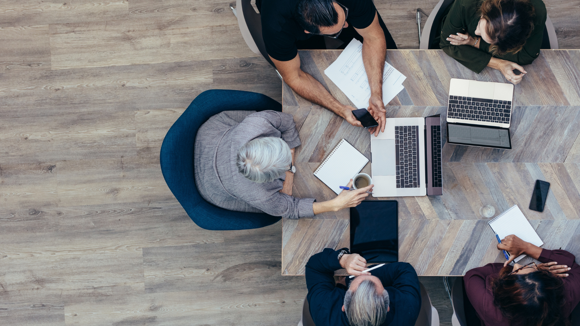 Cross-departmental team meeting to align on workplace technology decisions